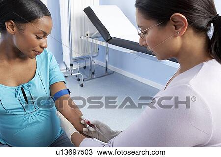 Stock Image - Obstetric examination. Fotosearch