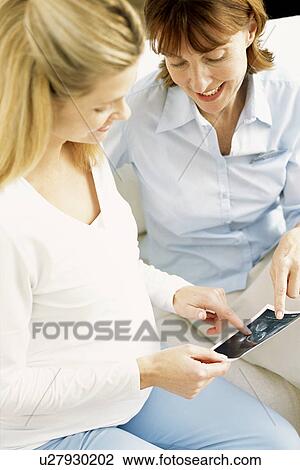 Stock Image - Obstetric examination. Fotosearch