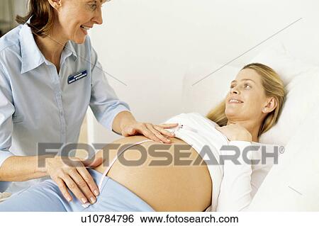 Stock Photograph - Obstetric examination. Fotosearch