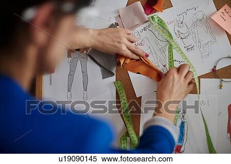 Over shoulder view of woman looking at mood board View Large Photo Image Stock Photography - Over shoulder view of woman looking at mood board. Fotosearch