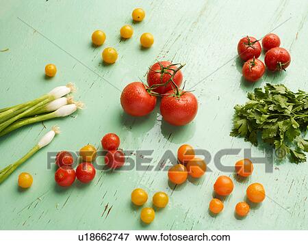Overhead view of vegetables on green background View Large Photo Image Stock Photo - Overhead view of vegetables on green background. Fotosearch