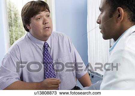 Overweight man consulting his doctor View Large Photo Image Stock Image - Overweight man consulting his doctor. Fotosearch