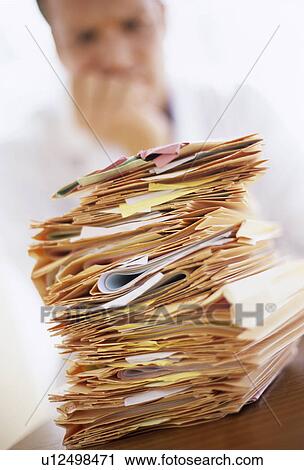 Stock Image - Overworked doctor. Fotosearch