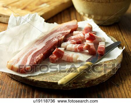 Pancetta on vintage chopping board View Large Photo Image Stock Photograph - Pancetta on vintage chopping board. Fotosearch