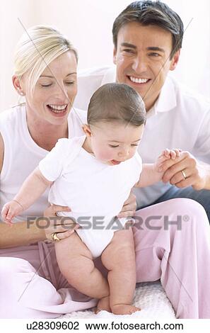 Stock Image - Parents and baby boy. Fotosearch