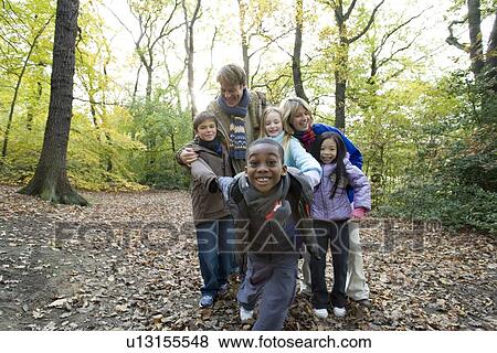 Parents and children in a wood View Large Photo Image Stock Photo - Parents and children in a wood. Fotosearch