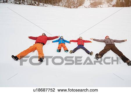 Parents and sons lying in snow covered landscape, Elmau, Bavaria, Germany View Large Photo Image Stock Image - Parents and sons lying in snow covered landscape, Elmau, Bavaria, Germany. Fotosearch