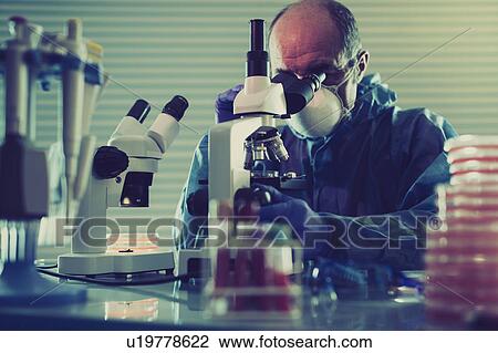 Person using microscope View Large Photo Image Stock Image - Person using microscope. Fotosearch