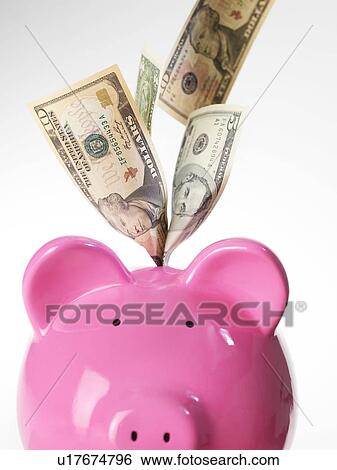 Stock Photograph - Piggy bank and US dollars. Fotosearch