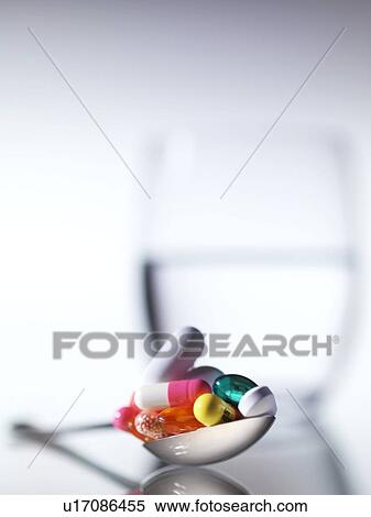 Pills on a spoon View Large Photo Image Stock Photography - Pills on a spoon. Fotosearch