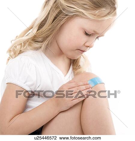 Plaster on a girl's knee View Large Photo Image Stock Image - Plaster on a girl's knee. Fotosearch