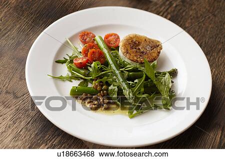 Plate of peppered fried goats cheese and salad View Large Photo Image Stock Photo - Plate of peppered fried goats cheese and salad. Fotosearch