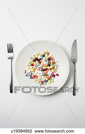 Plate with pills and cutlery View Large Photo Image Stock Image - Plate with pills and cutlery. Fotosearch