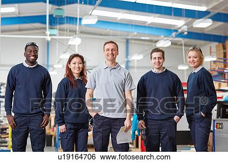 Stock Photograph - Portrait manager and team in manufacturing factory. Fotosearch
