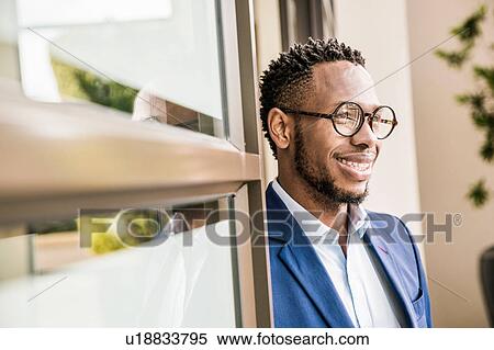 Portrait of businessman in office doorway View Large Photo Image Stock Photography - Portrait of businessman in office doorway. Fotosearch