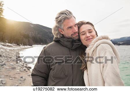 Portrait of couple beside lake, German Alps, Germany View Large Photo Image Stock Image - Portrait of couple beside lake, German Alps, Germany. Fotosearch