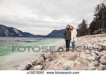 Portrait of couple beside lake, smiling, German Alps, Germany View Large Photo Image Stock Image - Portrait of couple beside lake, smiling, German Alps, Germany. Fotosearch