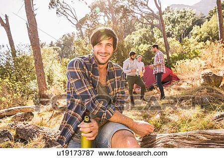Portrait of male camper with friends in forest, Deer Park, Cape Town, South Africa View Large Photo Image Stock Photo - Portrait of male camper with friends in forest, Deer Park, Cape Town, South Africa. Fotosearch