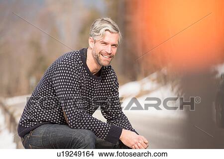 Portrait of mid adult man, outdoors, smiling View Large Photo Image Picture - Portrait of mid adult man, outdoors, smiling. Fotosearch