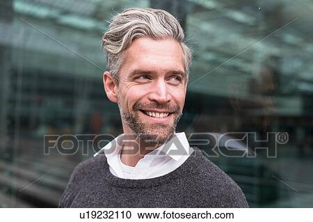 Portrait of mid adult man, outdoors, smiling View Large Photo Image Stock Image - Portrait of mid adult man, outdoors, smiling. Fotosearch