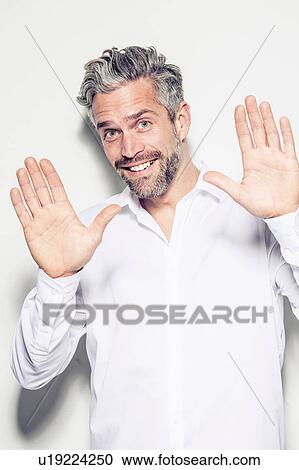 Portrait of mid adult man, showing palms of hands, smiling View Large Photo Image Stock Image - Portrait of mid adult man, showing palms of hands, smiling. Fotosearch