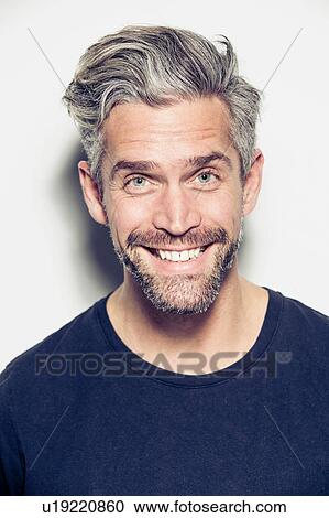 Portrait of mid adult man, smiling View Large Photo Image Stock Image - Portrait of mid adult man, smiling. Fotosearch