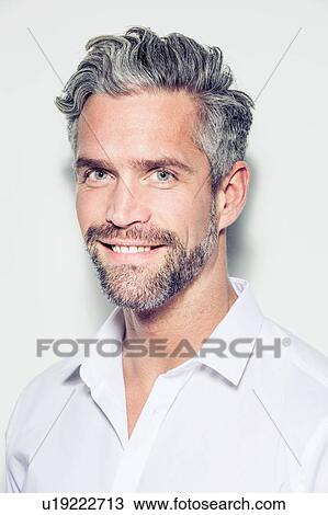 Portrait of mid adult man, smiling View Large Photo Image Stock Image - Portrait of mid adult man, smiling. Fotosearch