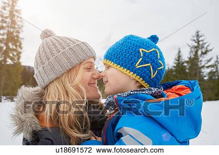 Portrait of mother and son nose to nose in winter, Elmau, Bavaria, Germany View Large Photo Image Stock Image - Portrait of mother and son nose to nose in winter, Elmau, Bavaria, Germany. Fotosearch