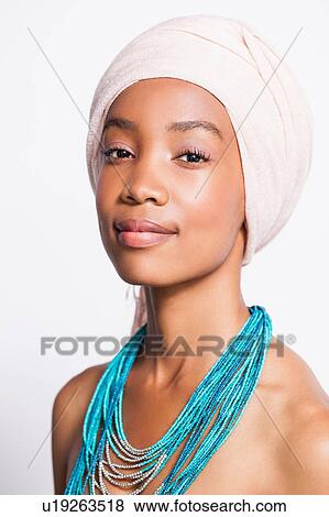 Portrait of woman wearing headscarf and statement necklace View Large Photo Image Stock Photo - Portrait of woman wearing headscarf and statement necklace. Fotosearch