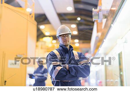 Portrait of worker in generating hall in hydroelectric power station View Large Photo Image Stock Photo - Portrait of worker in generating hall in hydroelectric power station. Fotosearch
