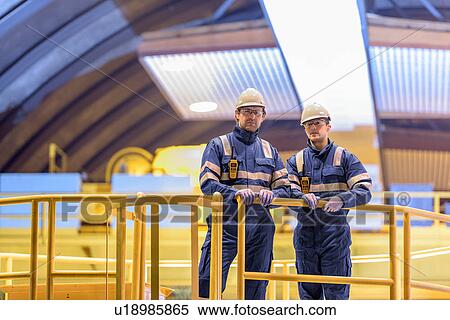 Stock Photography - Portrait of workers in generating hall in hydroelectric power station. Fotosearch