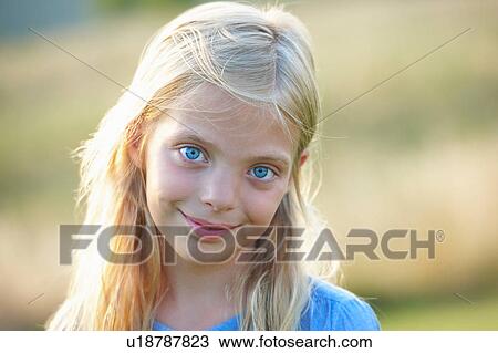 Portrait of young girl in field View Large Photo Image Stock Image - Portrait of young girl in field. Fotosearch