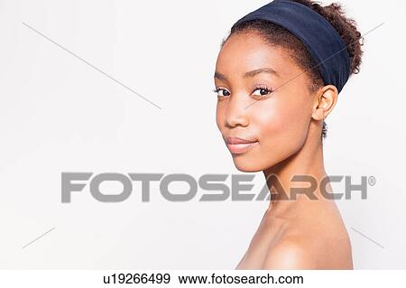 Portrait of young woman wearing headband View Large Photo Image Stock Photo - Portrait of young woman wearing headband. Fotosearch