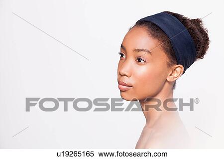 Portrait of young woman wearing headband View Large Photo Image Stock Photography - Portrait of young woman wearing headband. Fotosearch