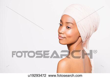 Portrait of young woman wearing headscarf View Large Photo Image Stock Image - Portrait of young woman wearing headscarf. Fotosearch