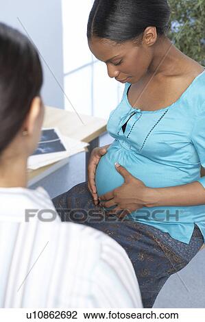 Stock Image - Pregnancy consultation. Fotosearch