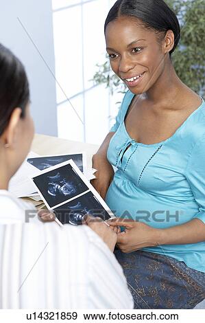 Pregnancy consultation View Large Photo Image Stock Photo - Pregnancy consultation. Fotosearch