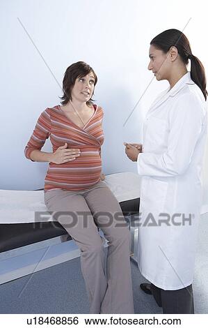 Pregnancy consultation View Large Photo Image Stock Photograph - Pregnancy consultation. Fotosearch