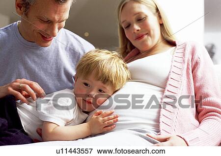 Stock Photo - Pregnant woman and family. Fotosearch