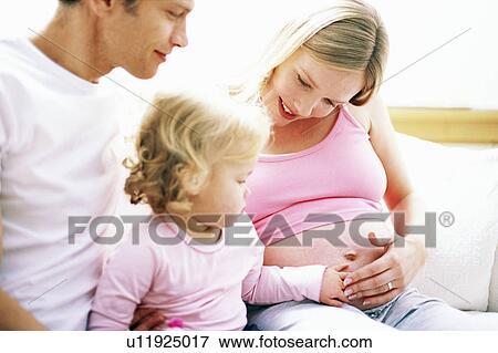 Stock Photo - Pregnant woman and family. Fotosearch
