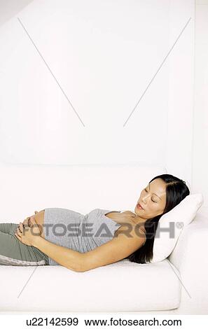 Stock Photo - Pregnant woman asleep. Fotosearch