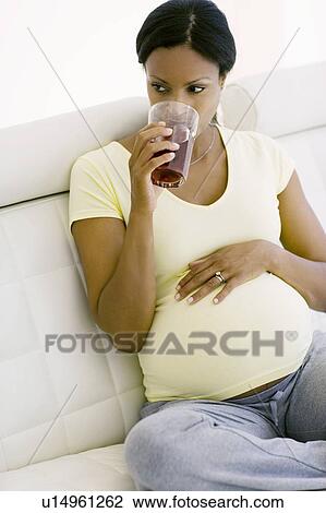 Pregnant woman drinking View Large Photo Image Stock Image - Pregnant woman drinking. Fotosearch