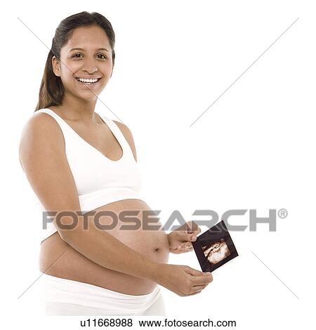 Pregnant woman holding her baby scan View Large Photo Image Stock Photo - Pregnant woman holding her baby scan. Fotosearch