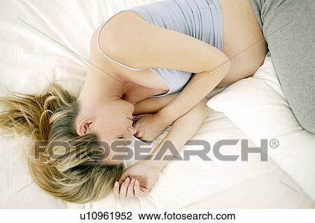 Stock Image - Pregnant woman sleeping. Fotosearch