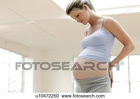 Stock Image - Pregnant woman. Fotosearch