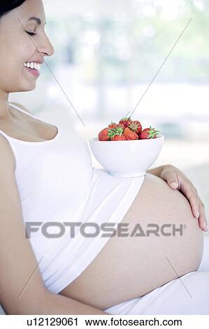 Stock Image - Pregnant woman. Fotosearch