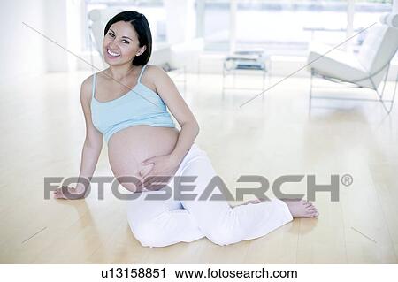 Stock Image - Pregnant woman. Fotosearch