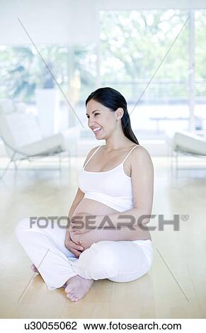 Stock Image - Pregnant woman. Fotosearch