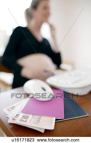 Stock Image - Pregnant woman working. Fotosearch