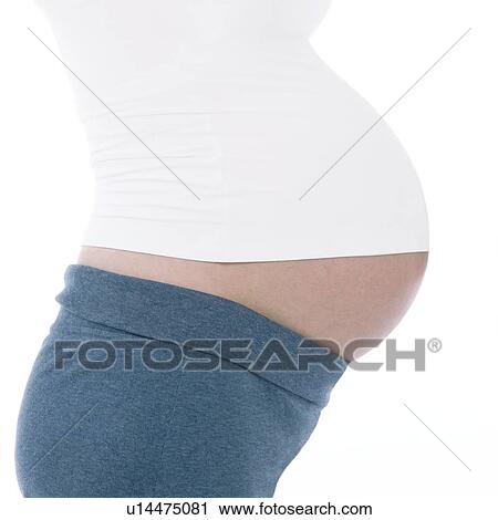 Stock Image - Pregnant woman's abdomen. Fotosearch